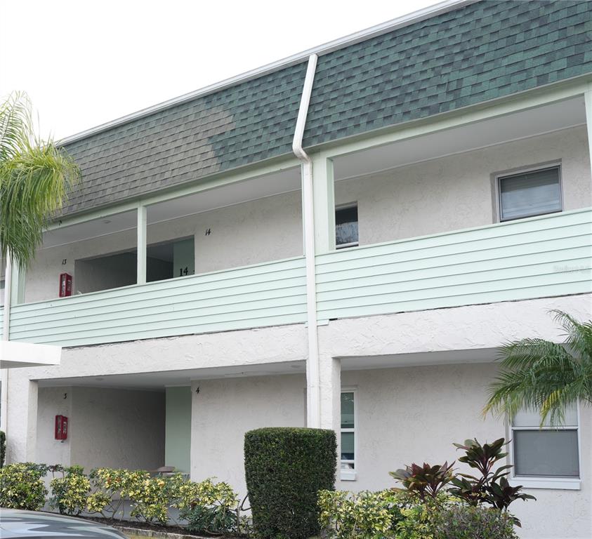 5434 Chad Place, Unit 14 New Port Richey, FL 34652 - Photo 2 of 13 a view of a house with a garage