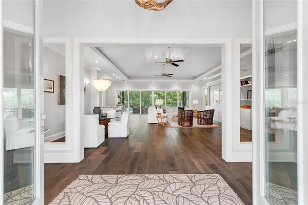 a living room with furniture and a floor to ceiling window