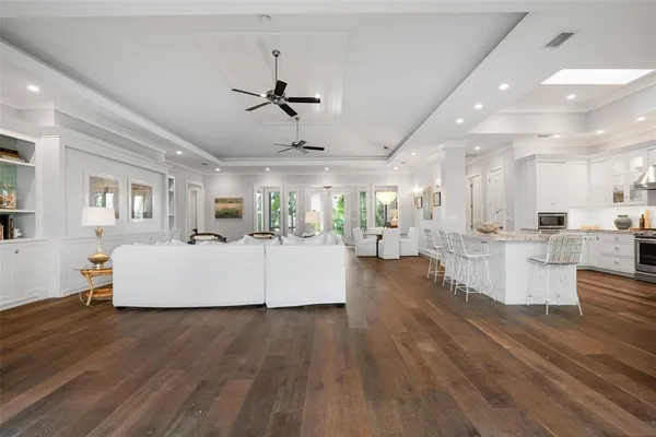 a kitchen with microwave a stove and white cabinets