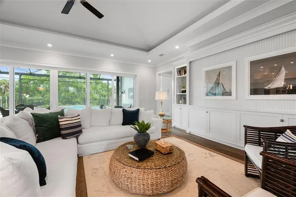 a kitchen with stainless steel appliances granite countertop a refrigerator a stove a sink and white cabinets