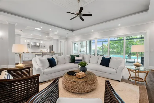 a bedroom with a bed and a large window with balcony view