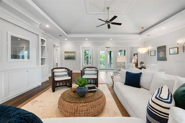 a spacious bathroom with a tub mirror and window