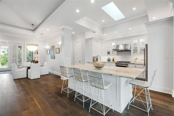 a spacious bathroom with a double vanity sink a mirror and a bathtub