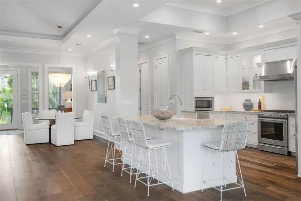a bathroom with a sink a vanity a mirror and shower