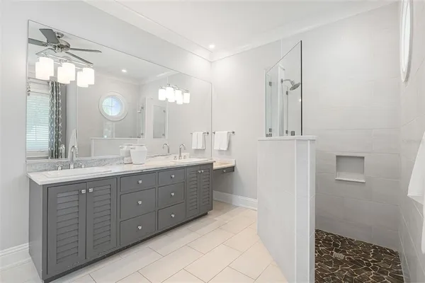 a living room with furniture and a large window with garden view