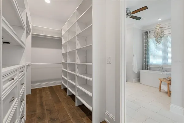 a dining room with furniture and a floor to ceiling window