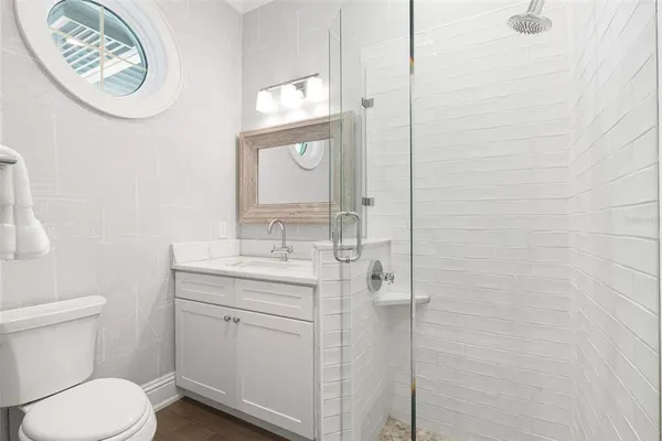 a living room with kitchen island furniture and a rug