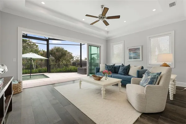 a patio table with chairs and a yard