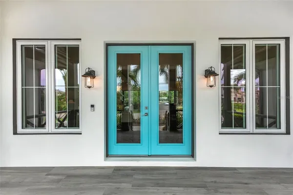 a view of a room with wooden floor and a window