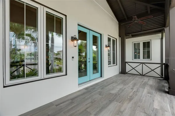 a living room with furniture and a mirror