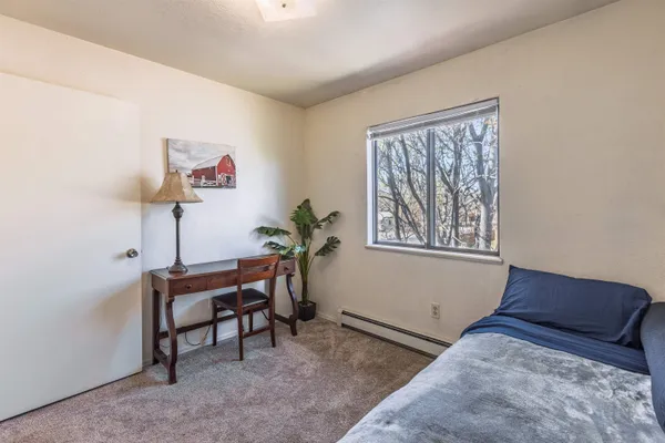 a view of workspace with furniture and window