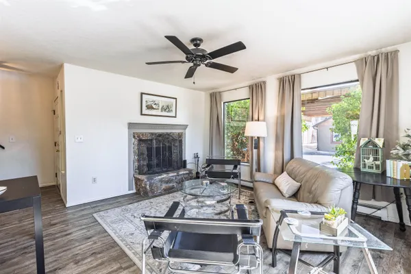a living room with furniture and a fireplace