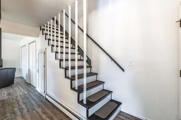 a view of entryway with wooden floor