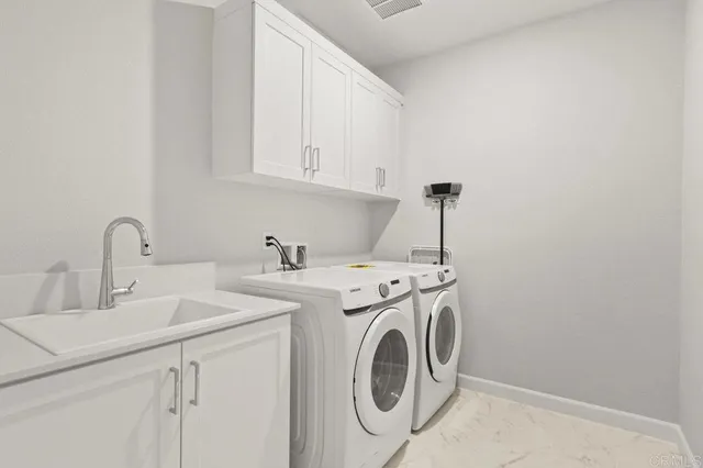 a bedroom with a bed and a lamp