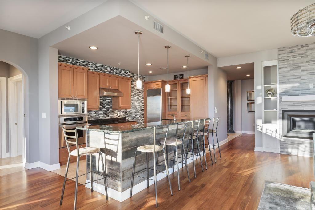 2828 Peachtree Road, Unit 2701 Atlanta, GA 30305 - Photo 11 of 39 a open kitchen with stainless steel appliances granite countertop a stove and refrigerator