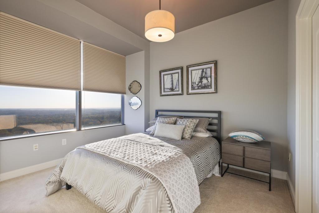 2828 Peachtree Road, Unit 2701 Atlanta, GA 30305 - Photo 16 of 39 a bedroom with a bed and window