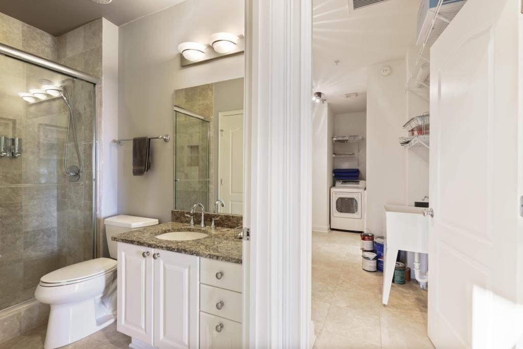 2828 Peachtree Road, Unit 2701 Atlanta, GA 30305 - Photo 18 of 39 a bathroom with a granite countertop sink toilet and shower