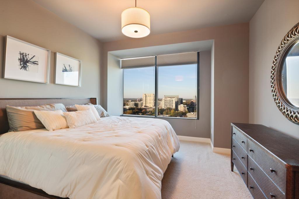 2828 Peachtree Road, Unit 2701 Atlanta, GA 30305 - Photo 25 of 39 a bedroom with a large bed and a window