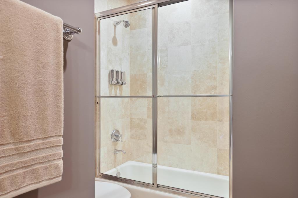 2828 Peachtree Road, Unit 2701 Atlanta, GA 30305 - Photo 27 of 39 a bathroom with a glass shower door