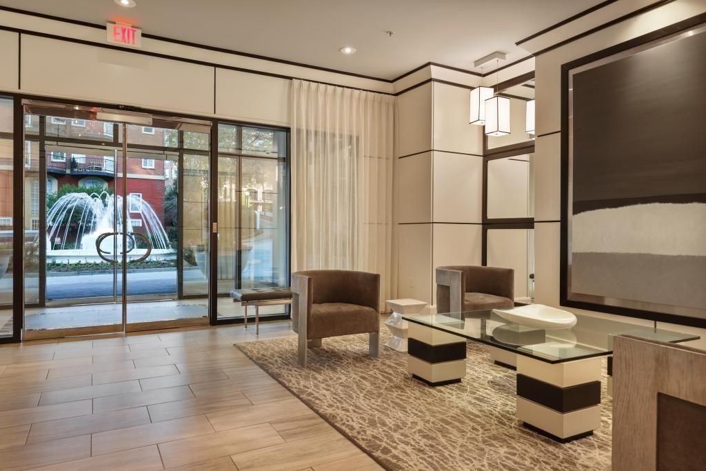 2828 Peachtree Road, Unit 2701 Atlanta, GA 30305 - Photo 30 of 39 a living room with furniture a flat screen tv and a large window