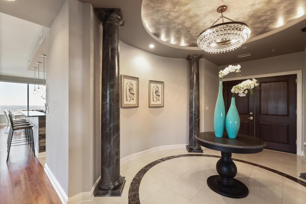 2828 Peachtree Road, Unit 2701 Atlanta, GA 30305 - Photo 3 of 39 a bathroom with a sink a mirror and shower