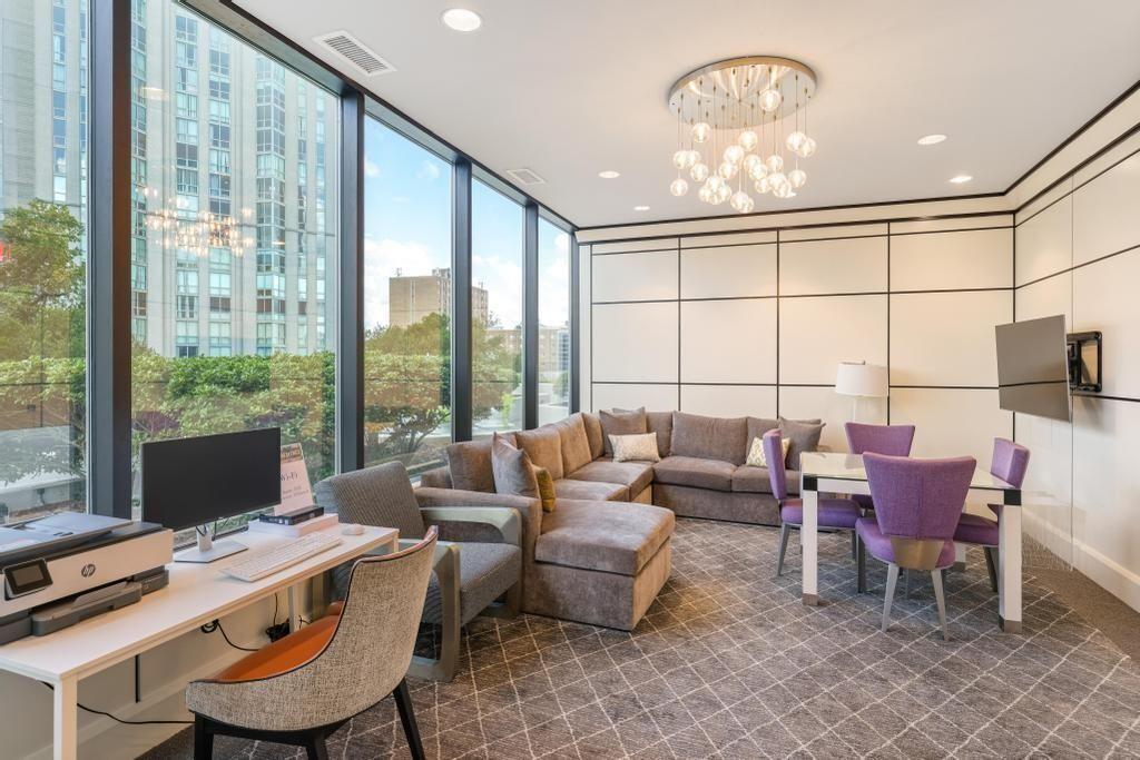 2828 Peachtree Road, Unit 2701 Atlanta, GA 30305 - Photo 35 of 39 a living room with furniture and a chandelier
