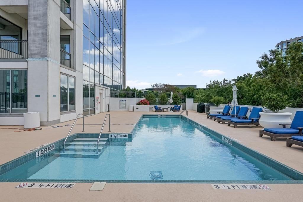 2828 Peachtree Road, Unit 2701 Atlanta, GA 30305 - Photo 37 of 39 a view of a swimming pool with lawn chairs