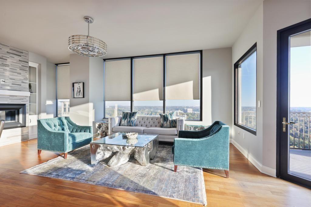 2828 Peachtree Road, Unit 2701 Atlanta, GA 30305 - Photo 7 of 39 a living room with fireplace furniture and a large window