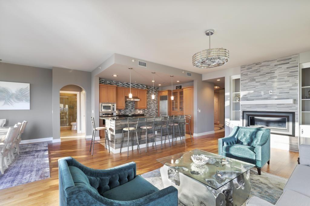 2828 Peachtree Road, Unit 2701 Atlanta, GA 30305 - Photo 8 of 39 a living room with fireplace furniture and a chandelier