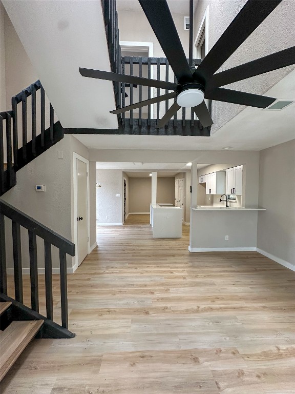 2709 Long Bow Trail Austin, TX 78734 - Photo 3 of 15 a view of a hallway with wooden floor and entryway