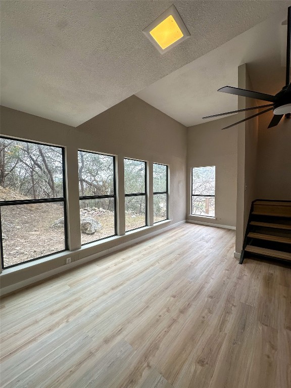 2709 Long Bow Trail Austin, TX 78734 - Photo 6 of 15 a view of an empty room with a window and wooden floor