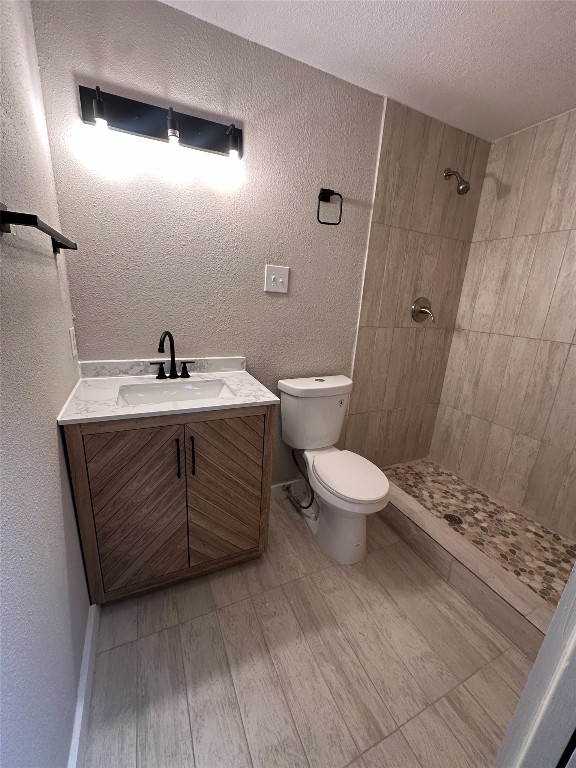 2709 Long Bow Trail Austin, TX 78734 - Photo 8 of 15 a bathroom with a sink a toilet a mirror and shower