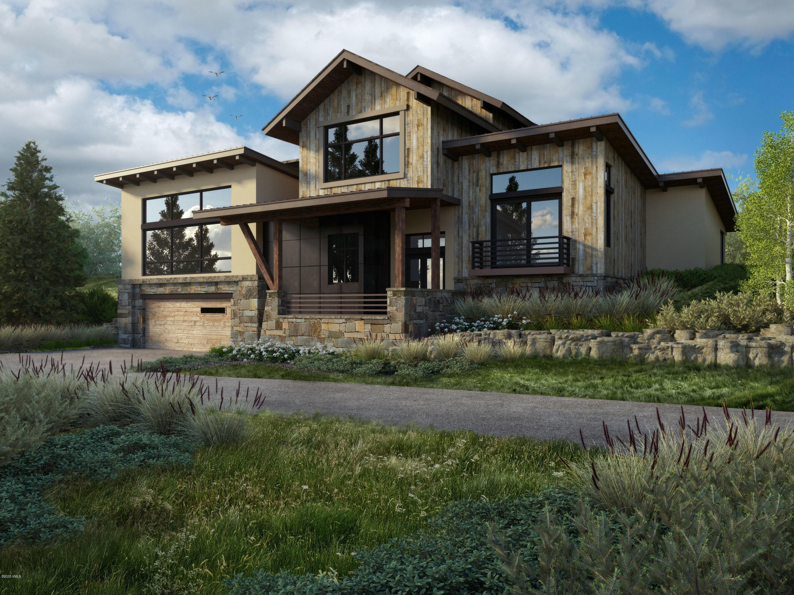 326 Brett Trail Edwards, CO 81632 - Photo 5 of 20 a front view of a house with a yard and garage