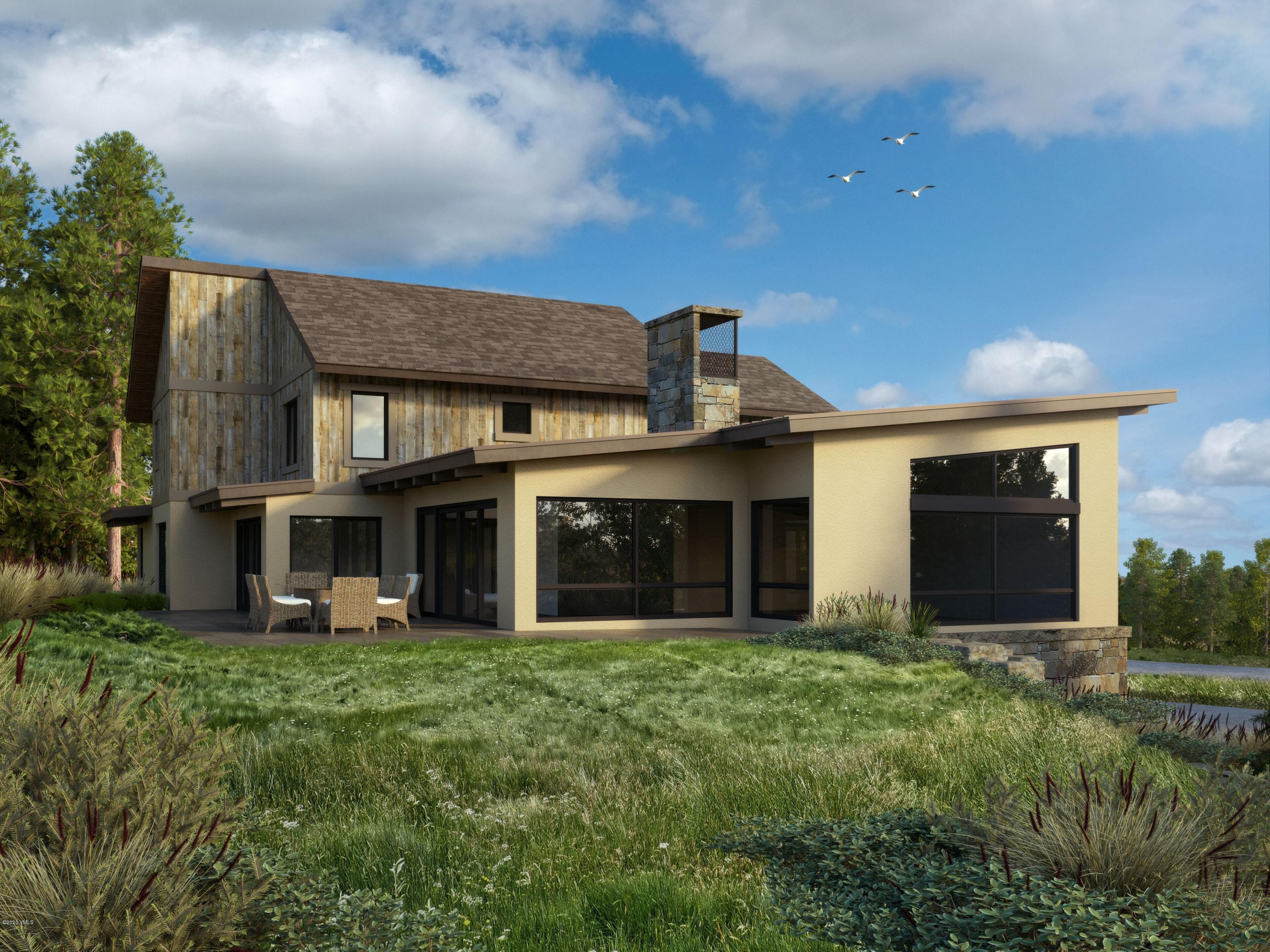 326 Brett Trail Edwards, CO 81632 - Photo 6 of 20 a front view of a house with garden