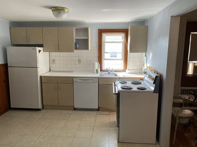 a utility room with closet a washer and dryer