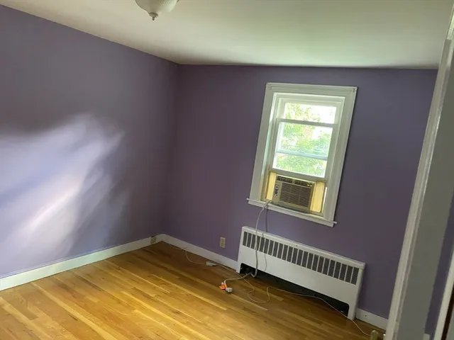 a view of an empty room and a window