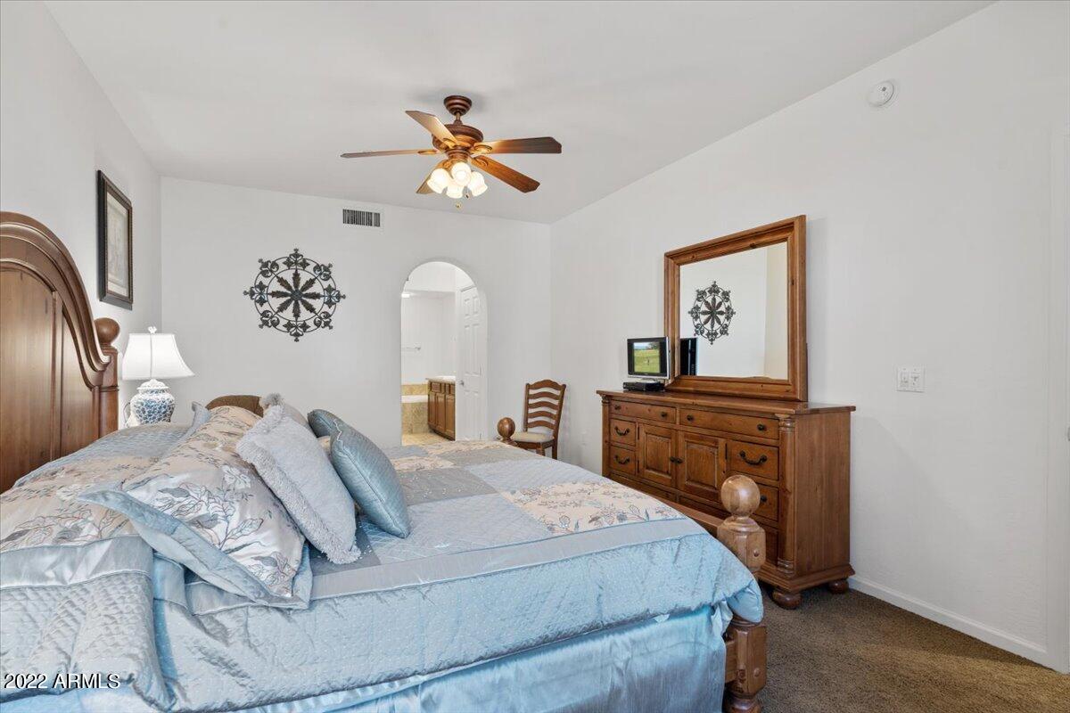 3935 East Rough Rider Road, Unit 1063 Phoenix, AZ 85050 - Photo 17 of 51 17-Primary Bedroom