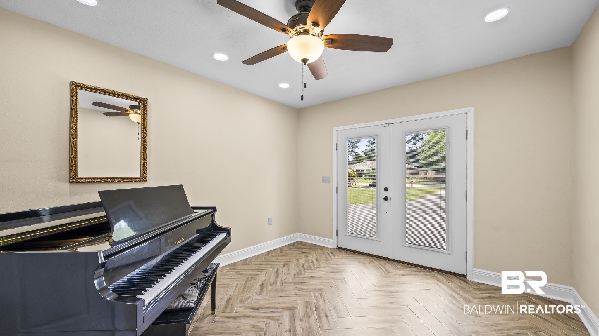 15096 Highland Circle Foley, AL 36535 - Photo 31 of 52 Room featuring herringbone wood-finish flooring, recessed lighting, and a ceiling fan with light fixture