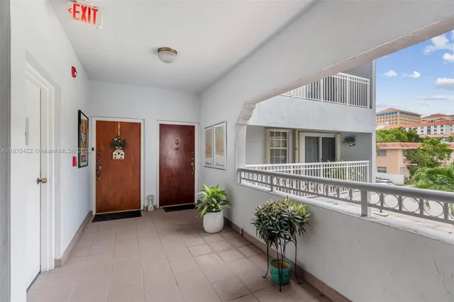 a potted plant sitting in front of a house
