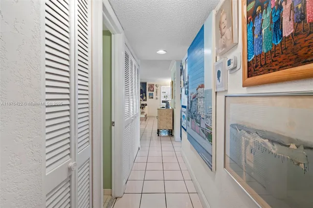 a view of a hallway with a kitchen