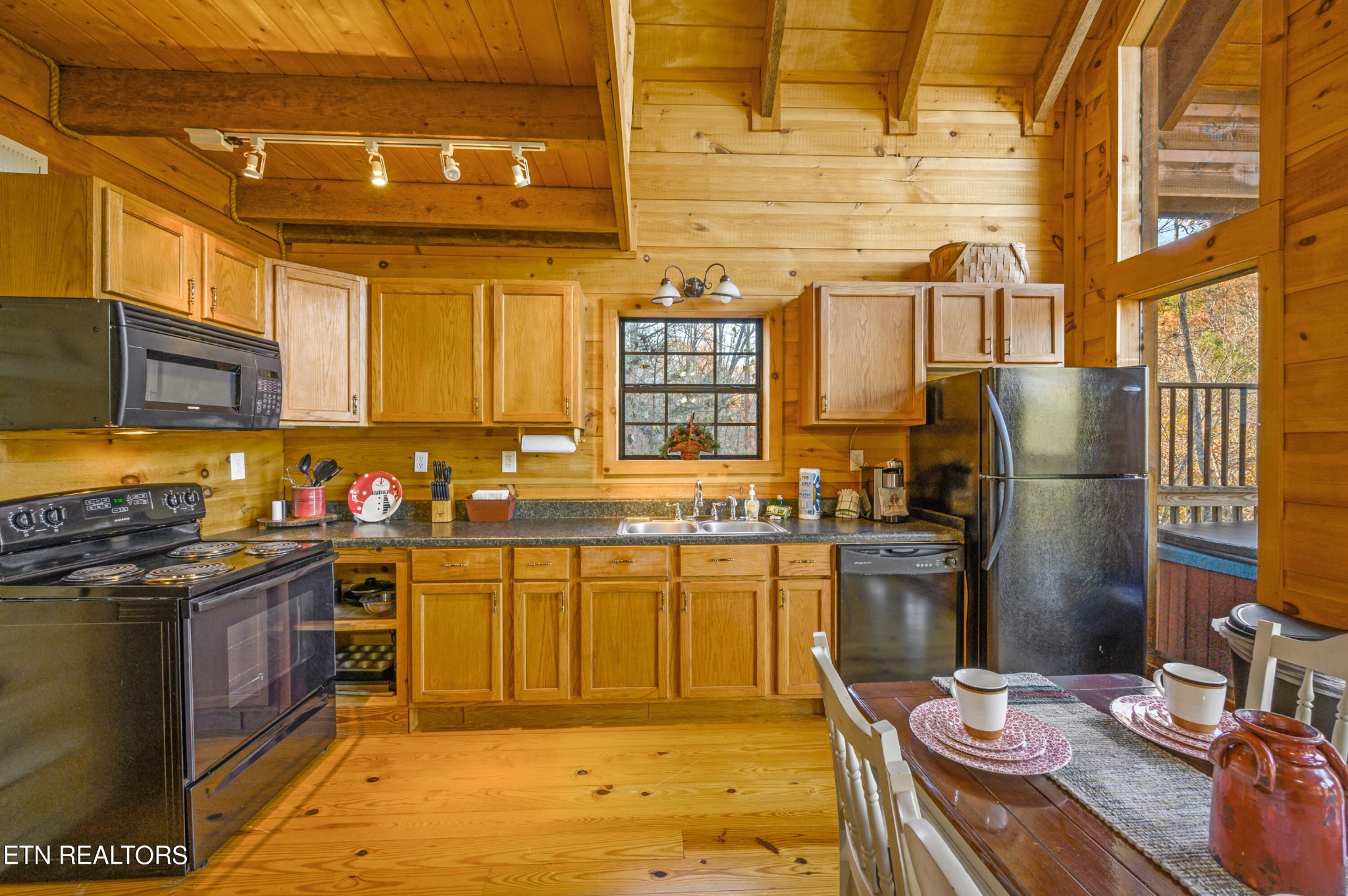 2505 Wildcat Ridge Road Sevierville, TN 37862 - Photo 5 of 48 a kitchen with stainless steel appliances granite countertop a sink stove and refrigerator