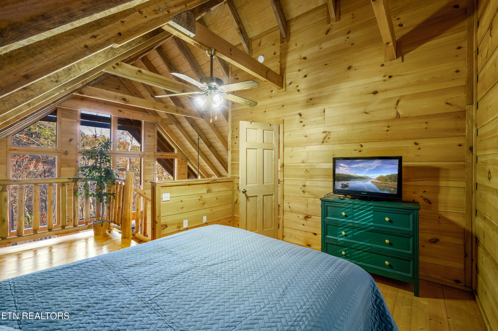 2505 Wildcat Ridge Road Sevierville, TN 37862 - Photo 8 of 48 a bedroom with a bed and a television