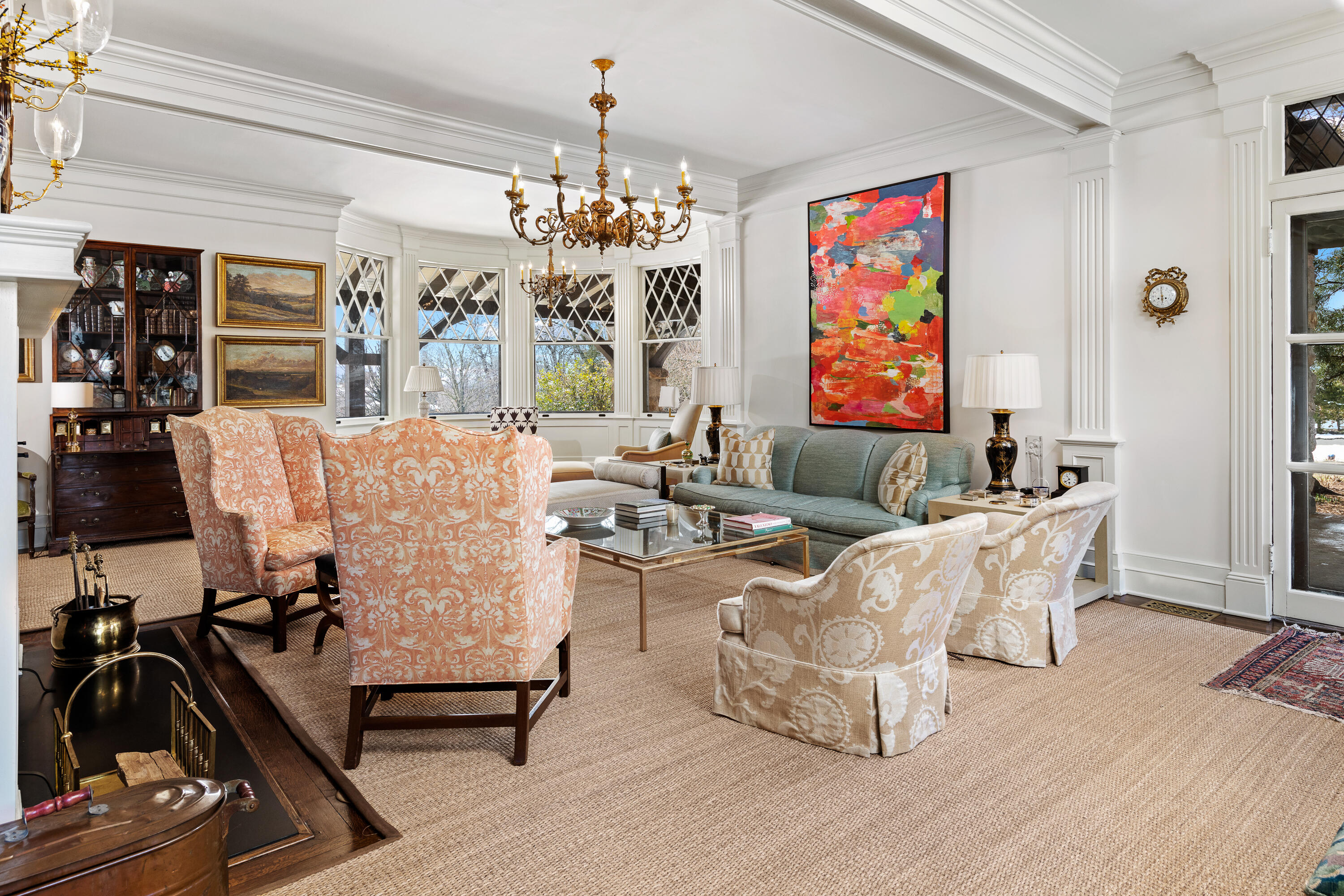 255 Brushy Ridge Road New Canaan, CT 06840 - Photo 23 of 40 a living room with furniture and a chandelier