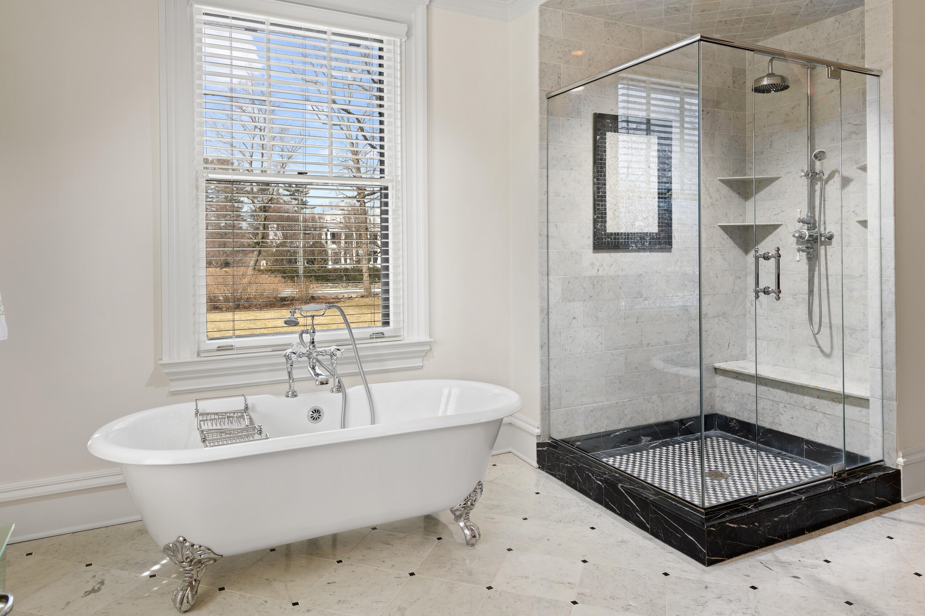 255 Brushy Ridge Road New Canaan, CT 06840 - Photo 31 of 40 a bathroom with a bathtub and shower