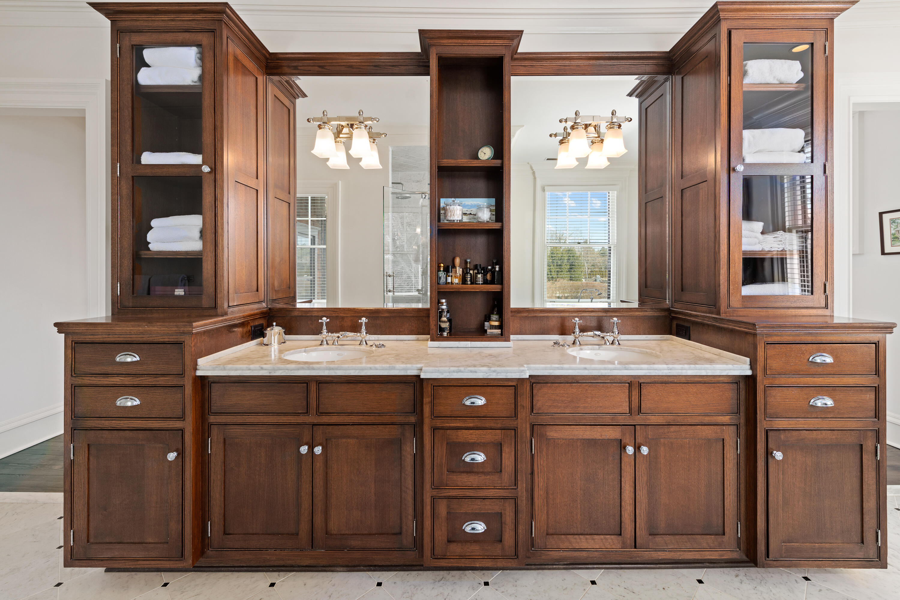 255 Brushy Ridge Road New Canaan, CT 06840 - Photo 32 of 40 a bathroom with a granite countertop sink two mirror and a window