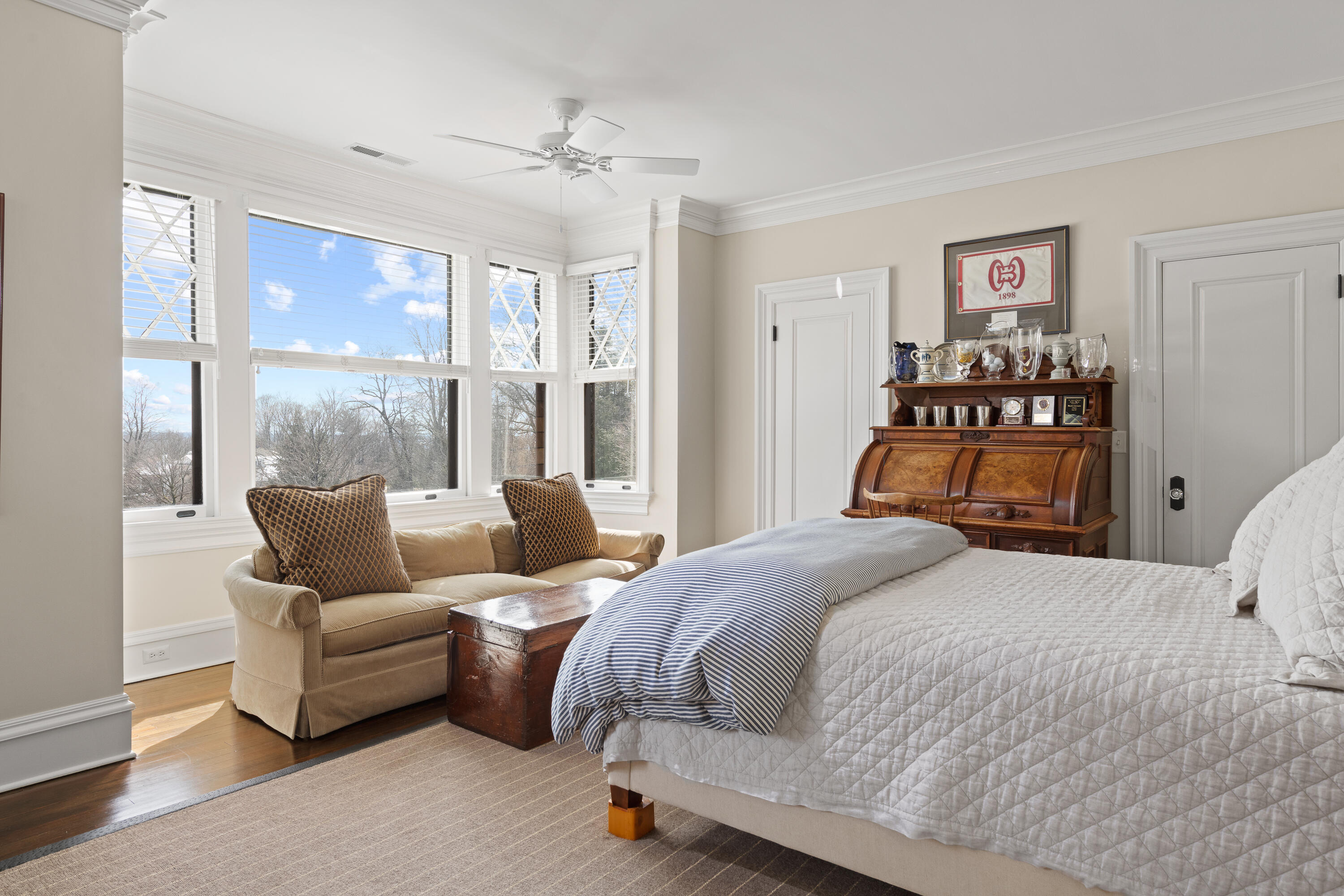 255 Brushy Ridge Road New Canaan, CT 06840 - Photo 34 of 40 a bedroom with a large bed and a couch