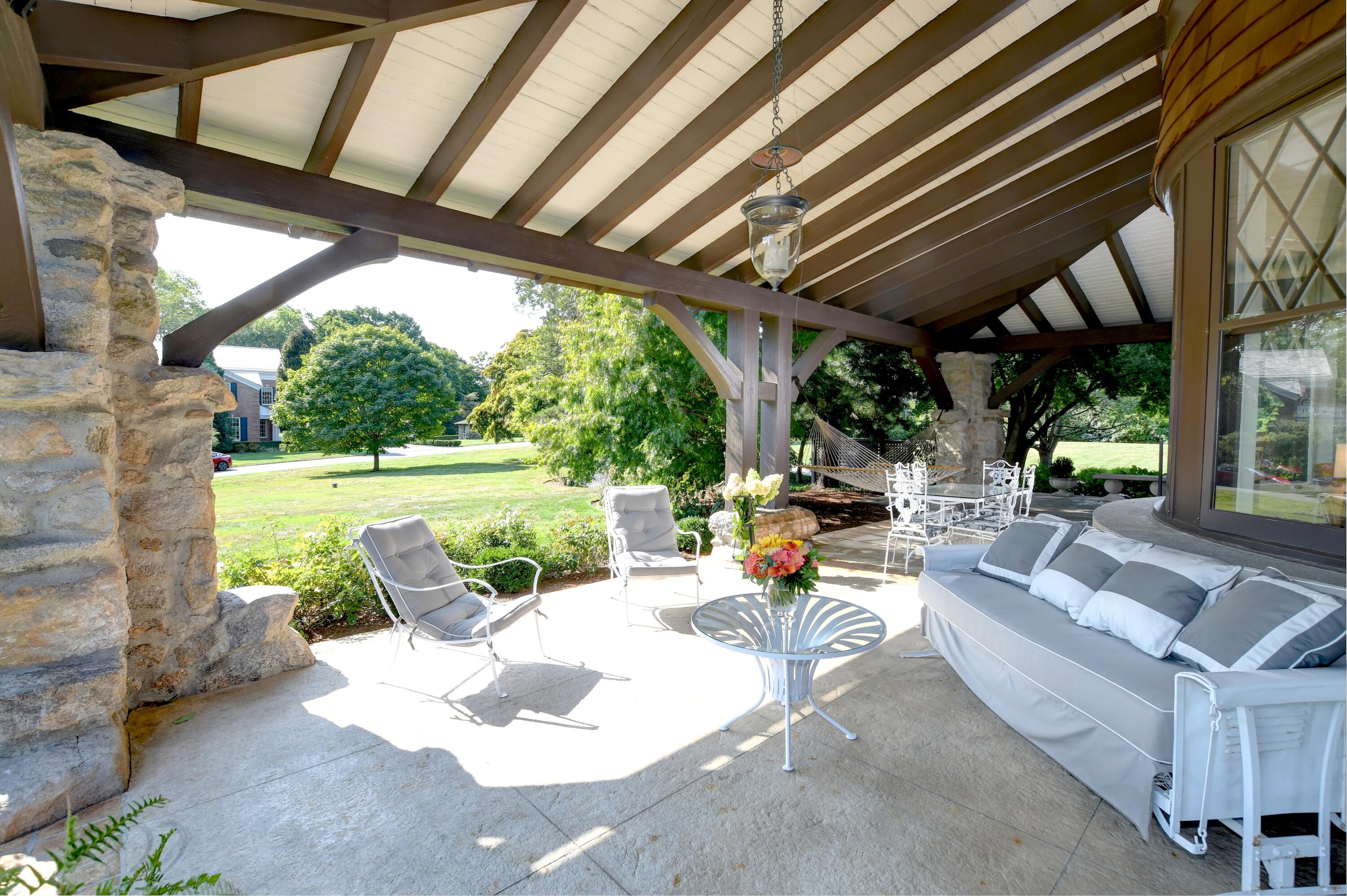 255 Brushy Ridge Road New Canaan, CT 06840 - Photo 8 of 40 a view of swimming pool with a patio