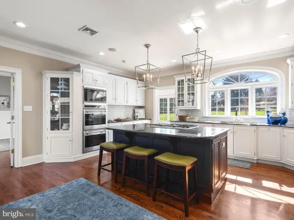 a bathroom with a toilet a sink and a window