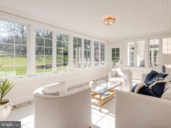 a view of a dining room with furniture wooden floor and chandelier