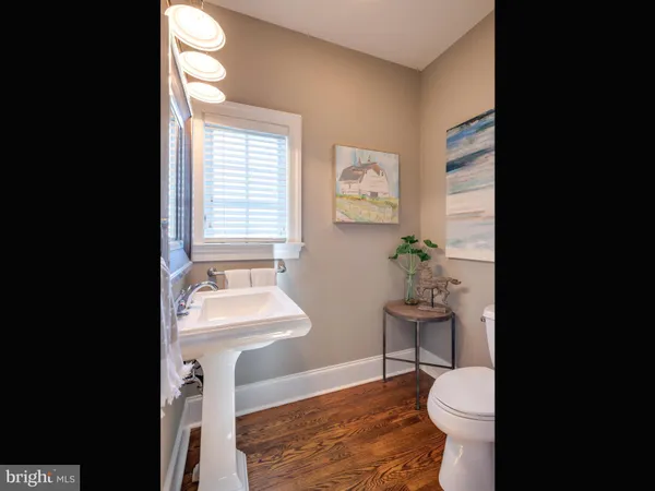 a living room with furniture and a book shelf